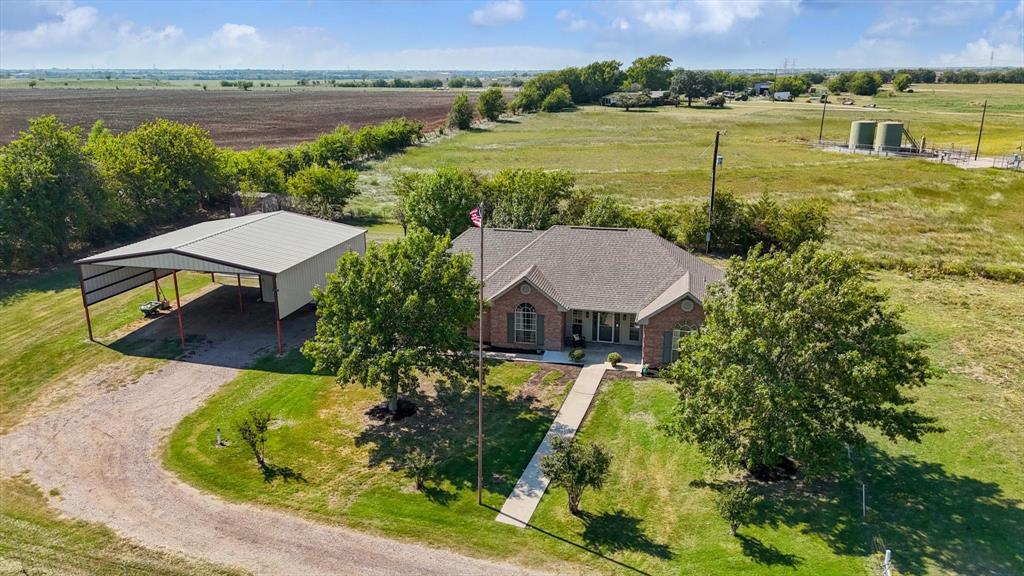 3289 Mitchell Road Krum, TX 76249 - Photo 32 of 38 an aerial view of a house with a lake view