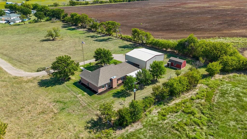 3289 Mitchell Road Krum, TX 76249 - Photo 34 of 38 an aerial view of a house with a lake view