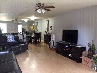 8787 Brae Acres Road, Unit 403 Houston, TX 77074 - Photo 3 of 7 a living room with furniture and a flat screen tv