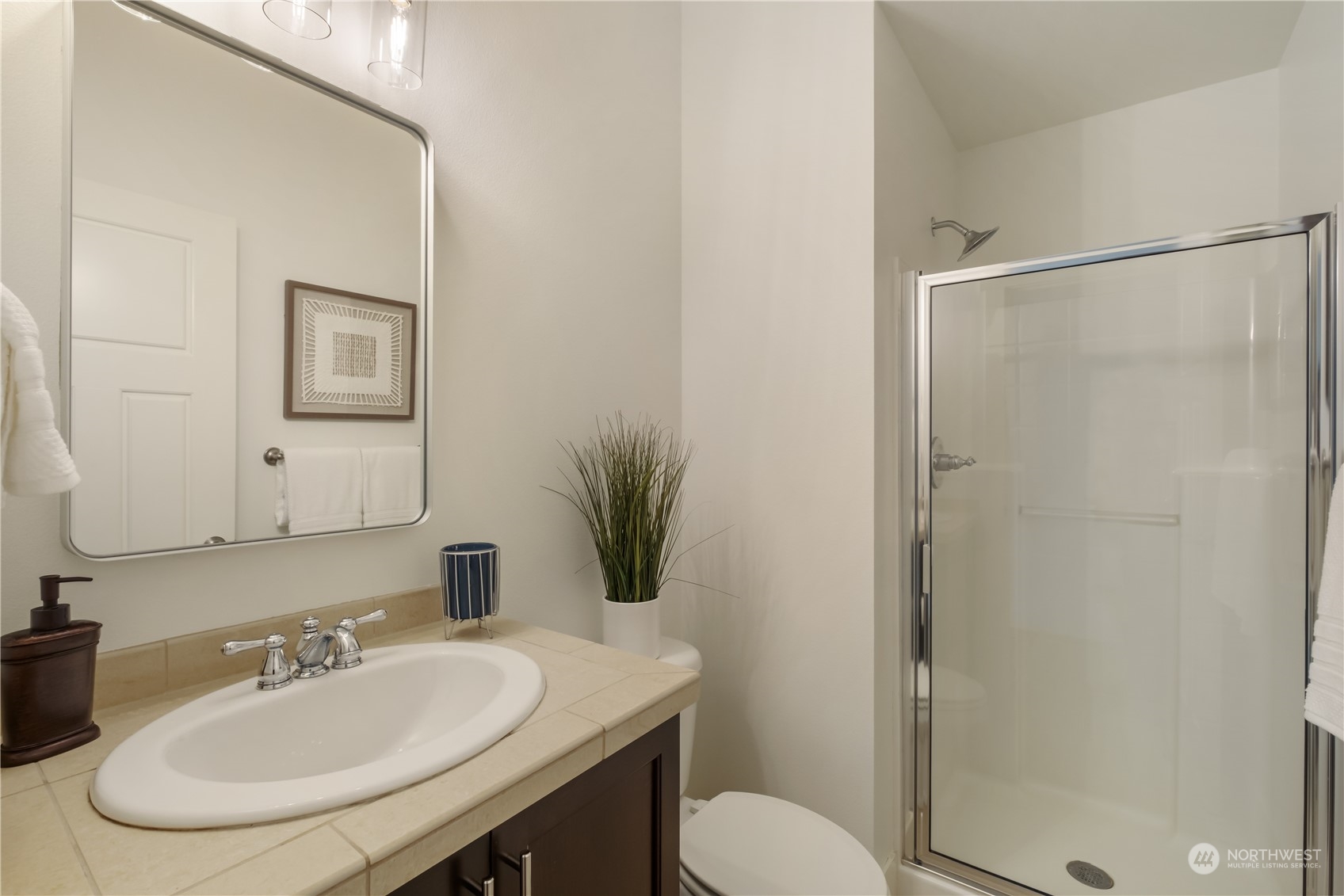 5525 Northeast 7th Place Renton, WA 98059 - Photo 13 of 30 a bathroom with a sink toilet and shower