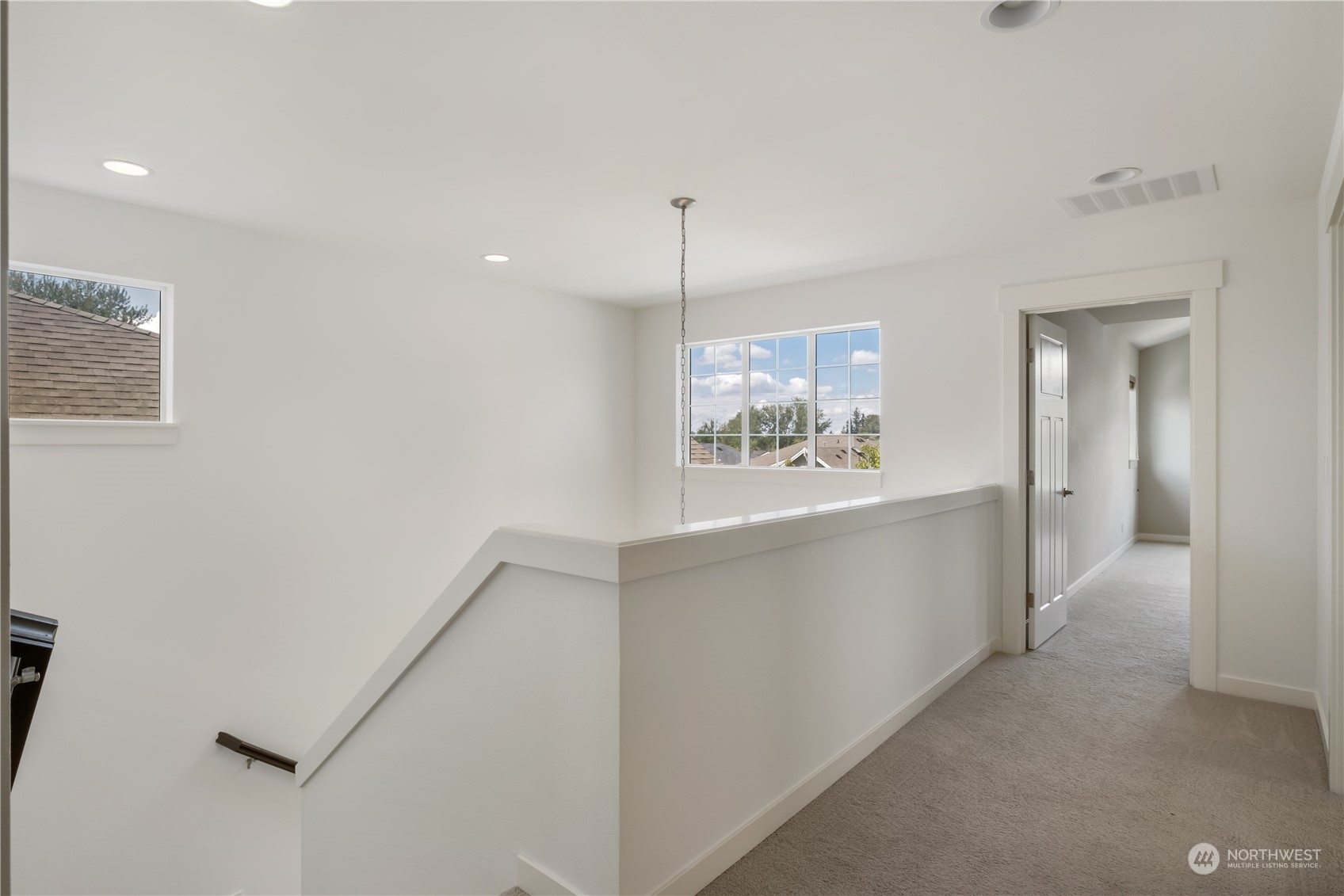 5525 Northeast 7th Place Renton, WA 98059 - Photo 14 of 30 a view of hallway with window and cabinet