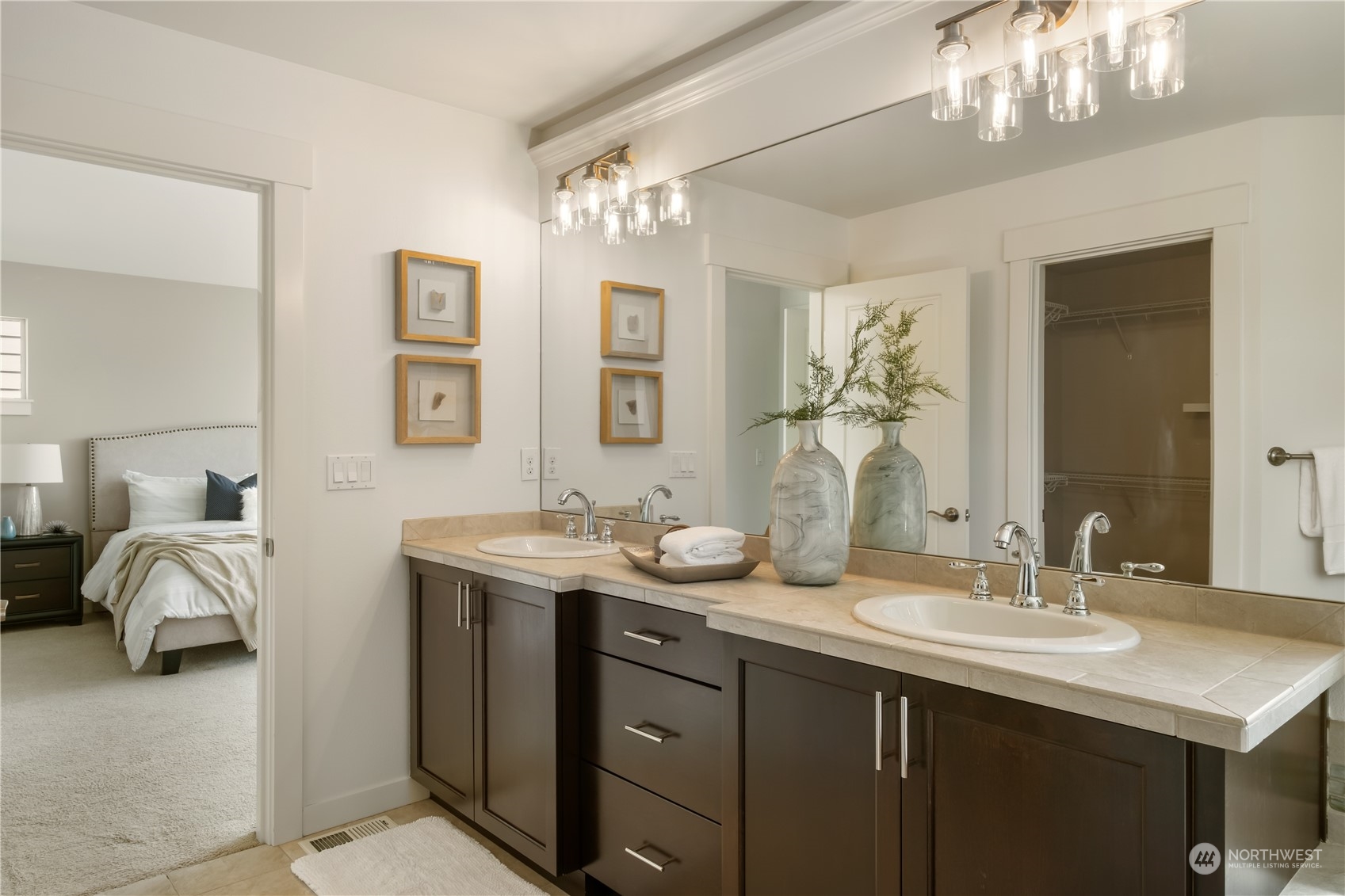 5525 Northeast 7th Place Renton, WA 98059 - Photo 18 of 30 a en suite bathroom with double sink and a mirror