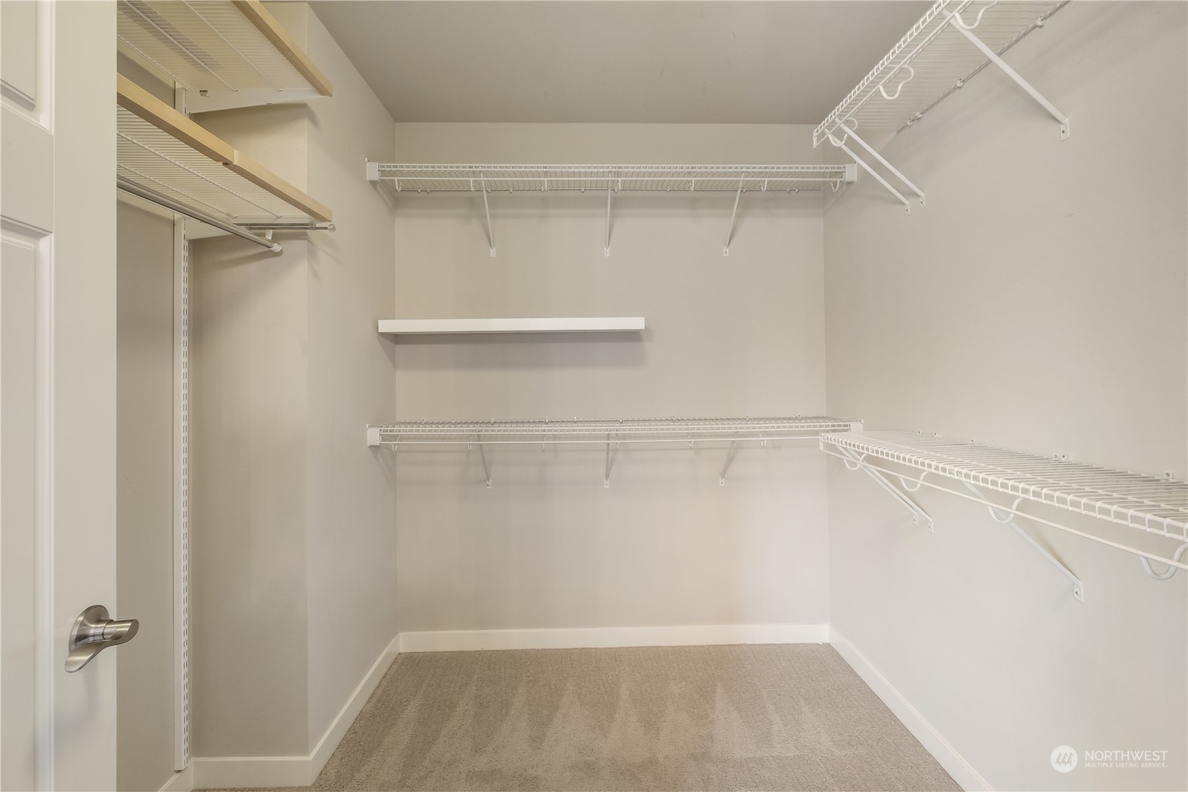 5525 Northeast 7th Place Renton, WA 98059 - Photo 19 of 30 a view of walk in closet with empty racks