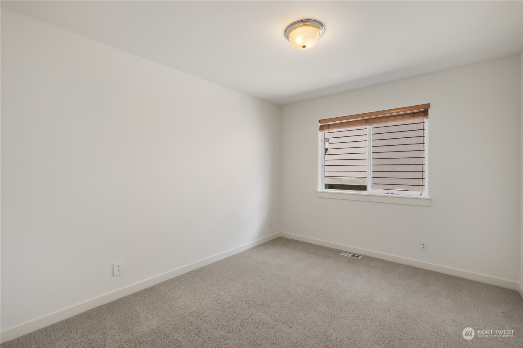 5525 Northeast 7th Place Renton, WA 98059 - Photo 22 of 30 an empty room with a window