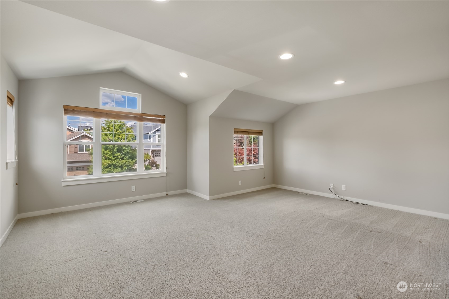 5525 Northeast 7th Place Renton, WA 98059 - Photo 23 of 30 an empty room with windows