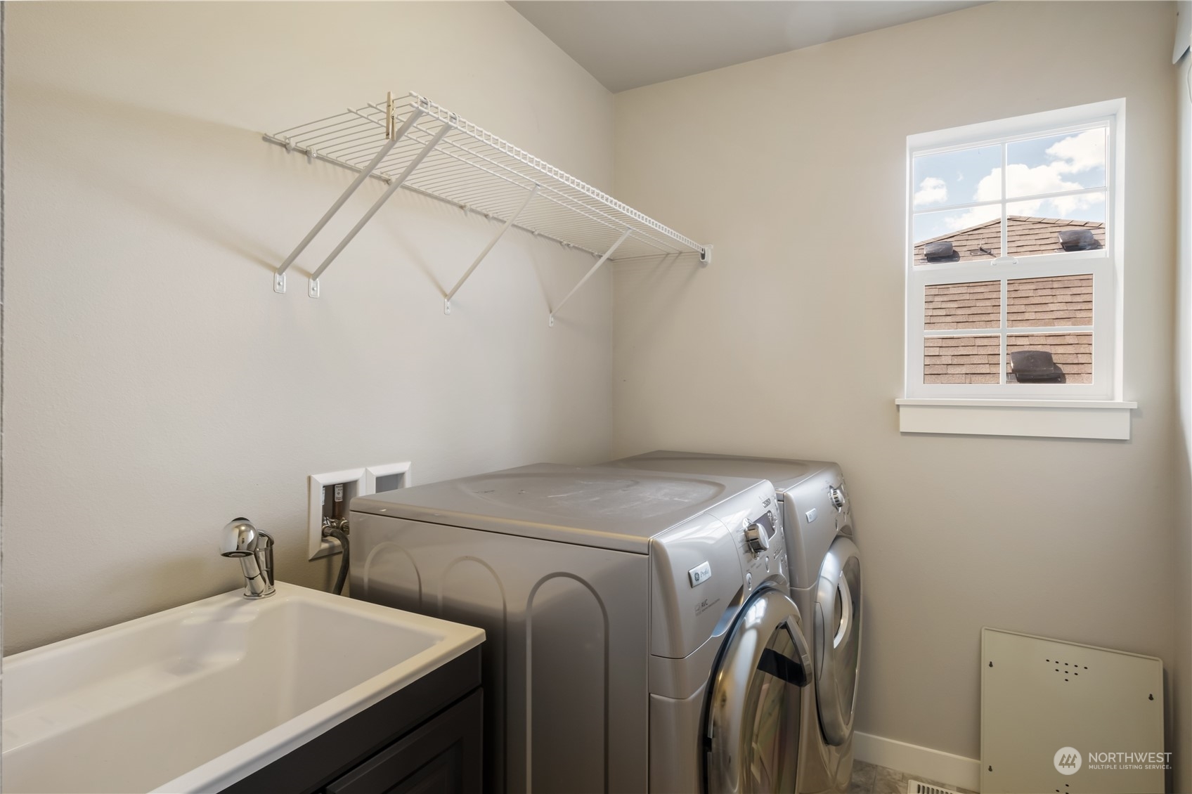 5525 Northeast 7th Place Renton, WA 98059 - Photo 24 of 30 a utility room with dryer and washer