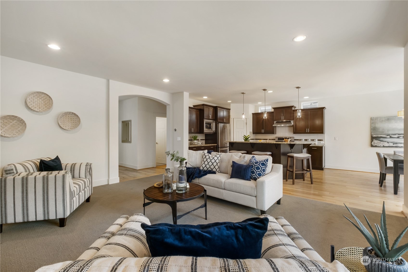 5525 Northeast 7th Place Renton, WA 98059 - Photo 5 of 30 a living room with furniture and kitchen view