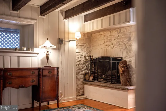 a bathroom with a window and a table