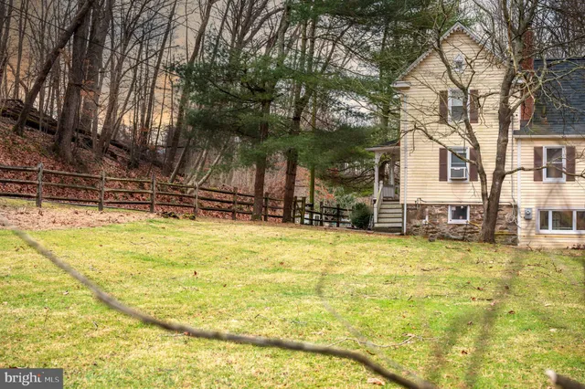 a swimming pool with outdoor seating and yard