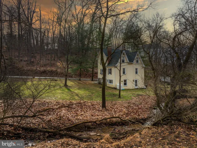 a view of backyard with green space