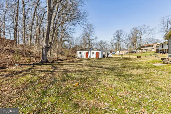 a view of a house with a yard and garage