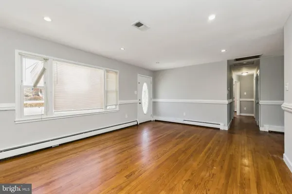 a kitchen with granite countertop cabinets stainless steel appliances a sink and a window