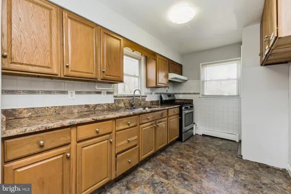 a bathroom with a sink mirror toilet and bathtub