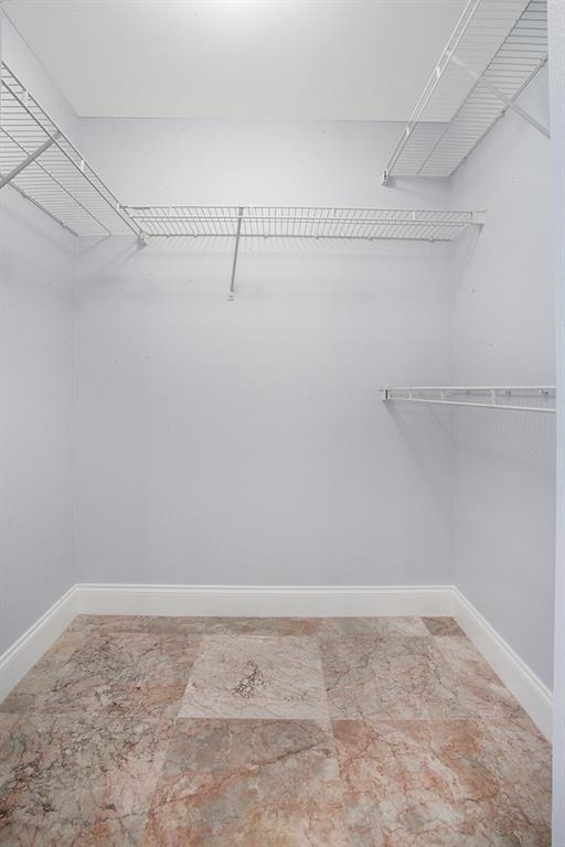 5860 West Sample Road, Unit 204 Coral Springs, FL 33067 - Photo 15 of 36 a view of a room with racks on the wall