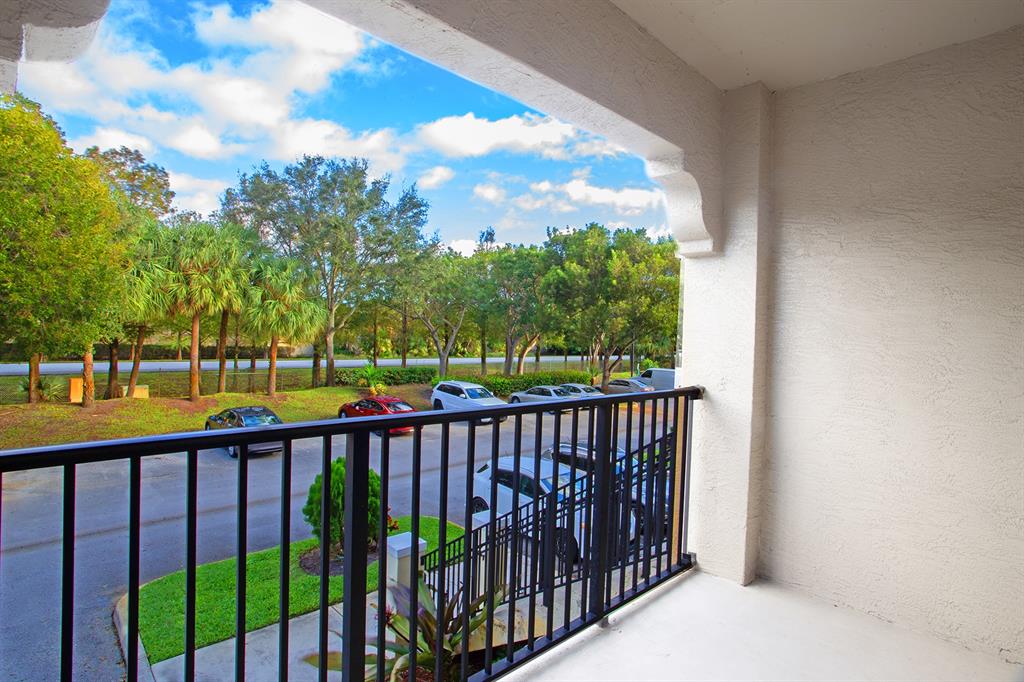 5860 West Sample Road, Unit 204 Coral Springs, FL 33067 - Photo 25 of 36 a view of city from a balcony