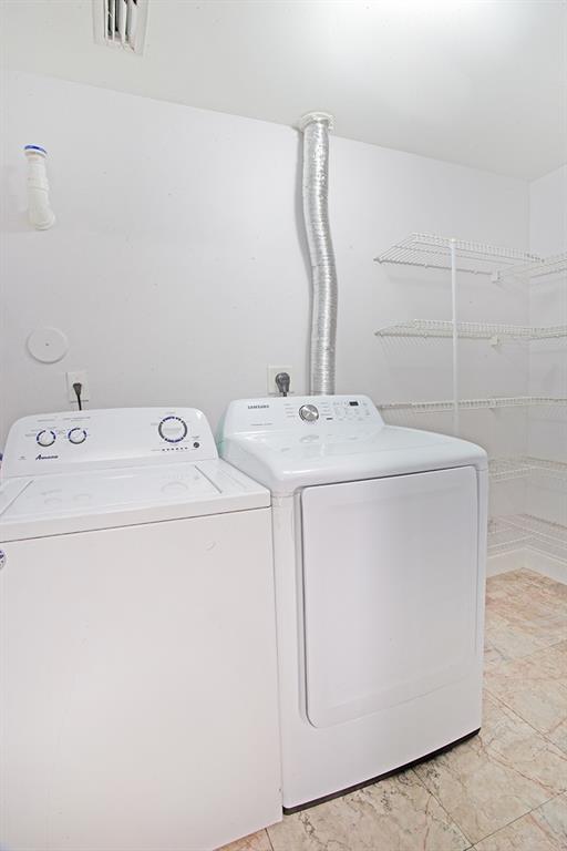 5860 West Sample Road, Unit 204 Coral Springs, FL 33067 - Photo 29 of 36 a utility room with dryer and washer