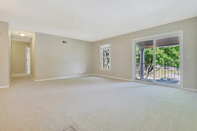 a view of a room with large windows