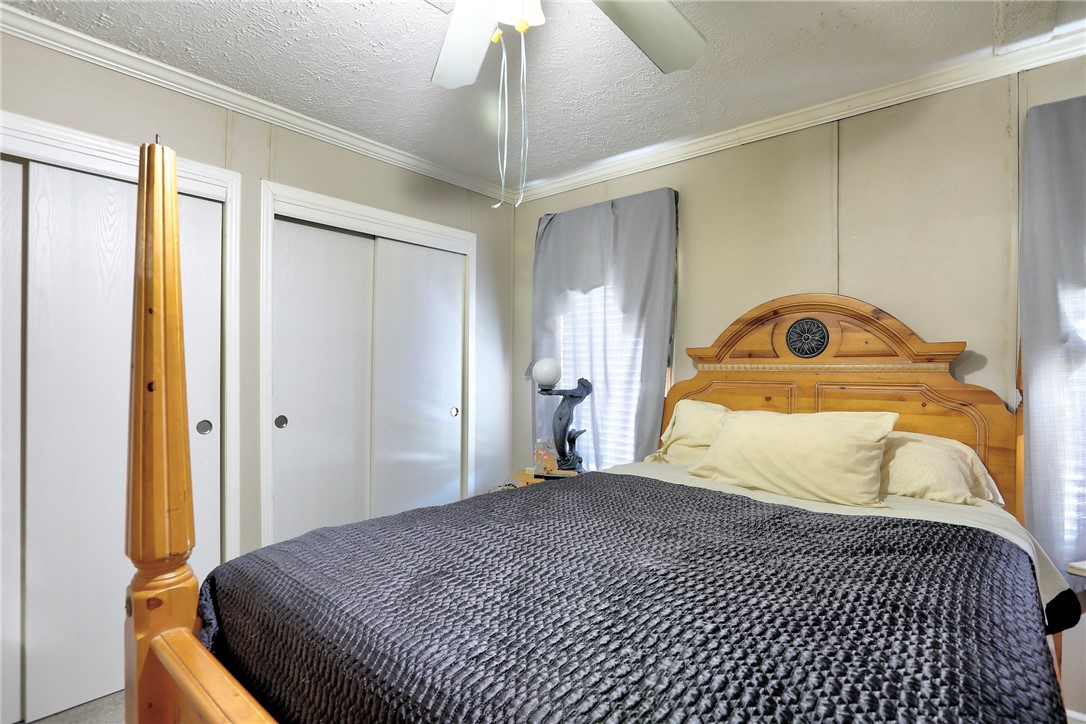 7820 Russell Street Sebastian, FL 32958 - Photo 17 of 36 a bedroom with a bed and a window
