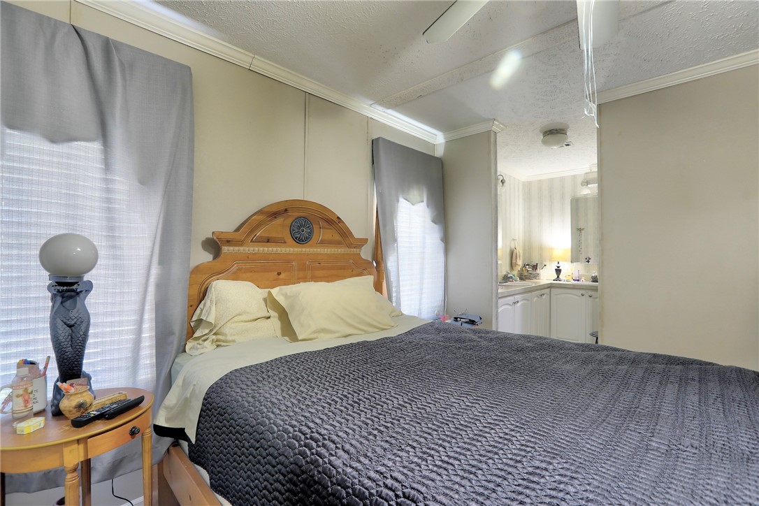 7820 Russell Street Sebastian, FL 32958 - Photo 18 of 36 a bedroom with a bed and a window