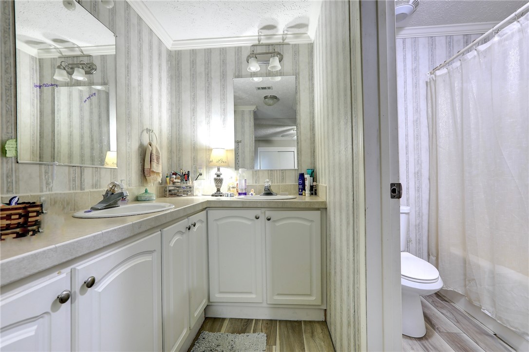 7820 Russell Street Sebastian, FL 32958 - Photo 19 of 36 a bathroom with a sink a toilet and shower