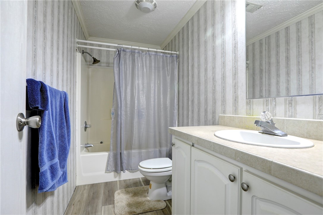 7820 Russell Street Sebastian, FL 32958 - Photo 21 of 36 a bathroom with a sink toilet and shower
