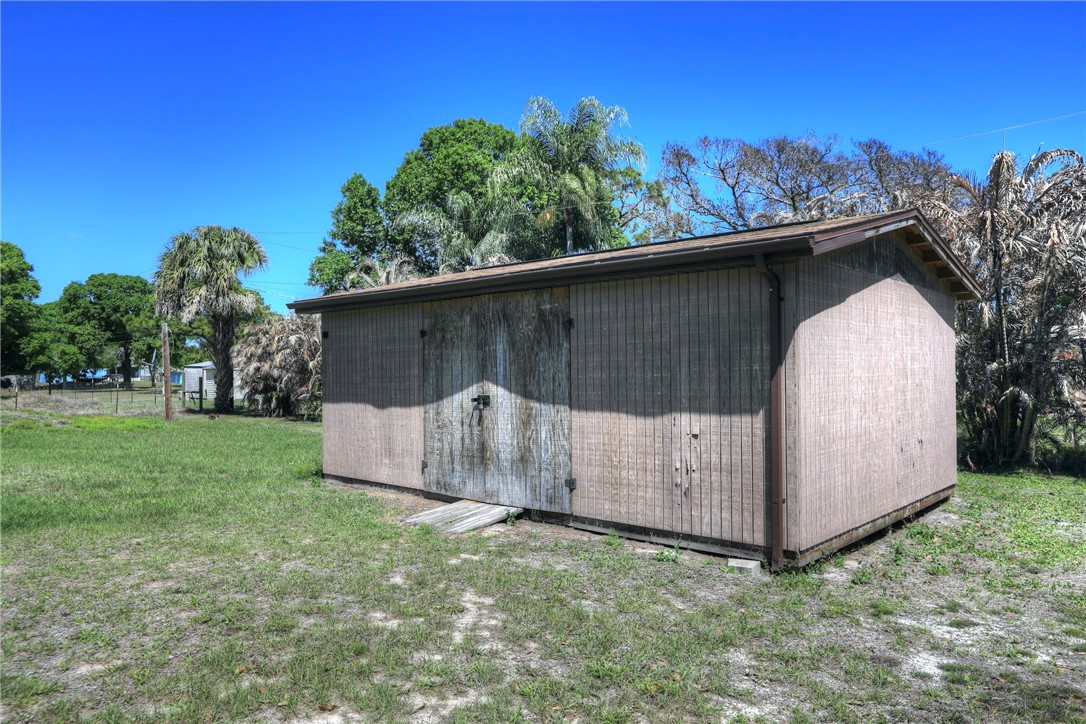7820 Russell Street Sebastian, FL 32958 - Photo 24 of 36 a view of a tiny house with a yard