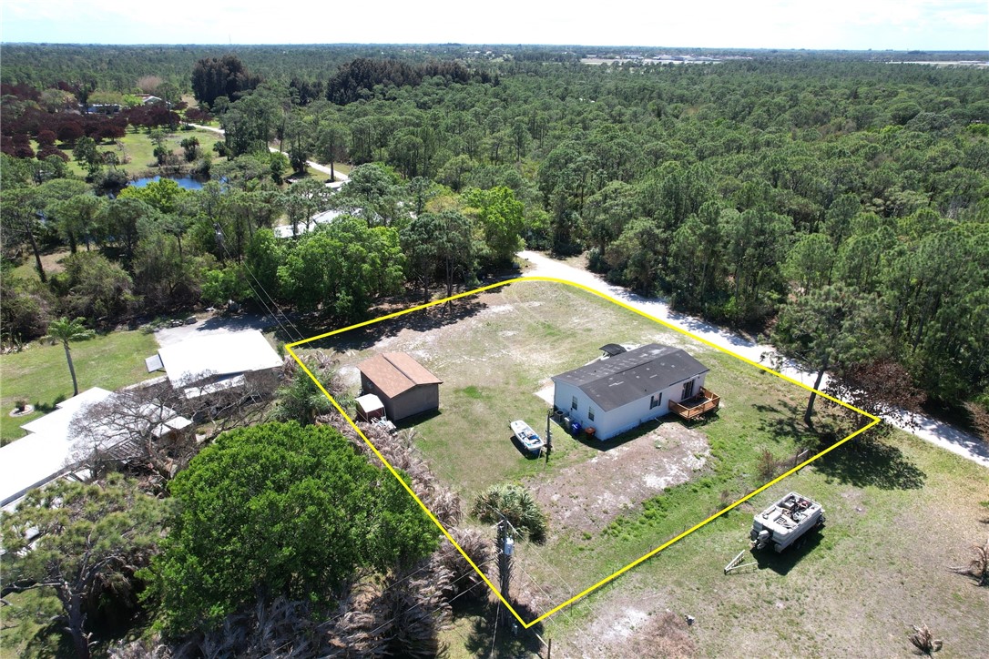 7820 Russell Street Sebastian, FL 32958 - Photo 25 of 36 an aerial view of a house with yard
