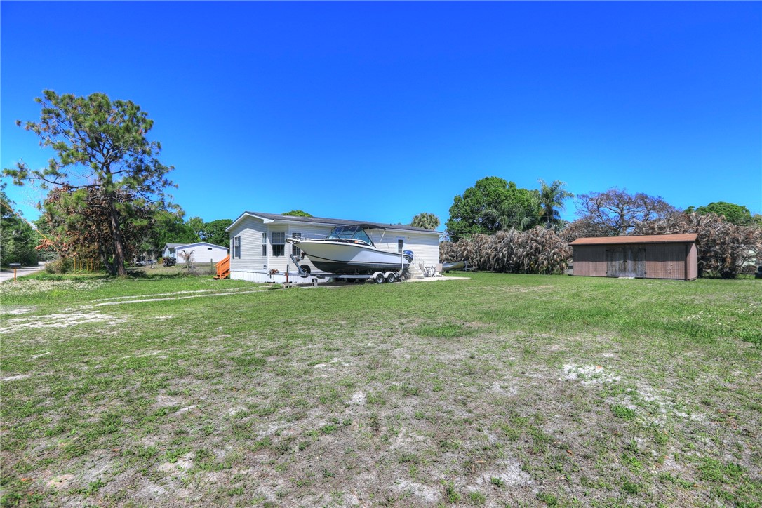 7820 Russell Street Sebastian, FL 32958 - Photo 26 of 36 a view of a house with a yard