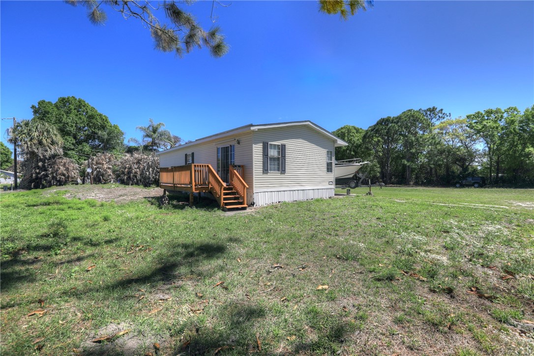 7820 Russell Street Sebastian, FL 32958 - Photo 29 of 36 a view of a house with a yard