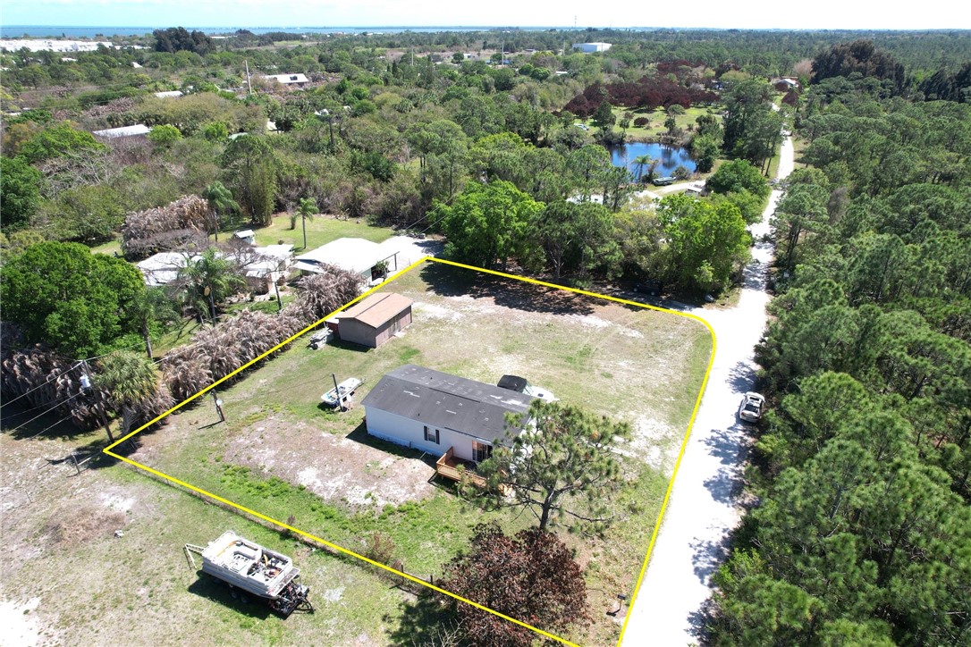 7820 Russell Street Sebastian, FL 32958 - Photo 5 of 36 an aerial view of residential houses with outdoor space