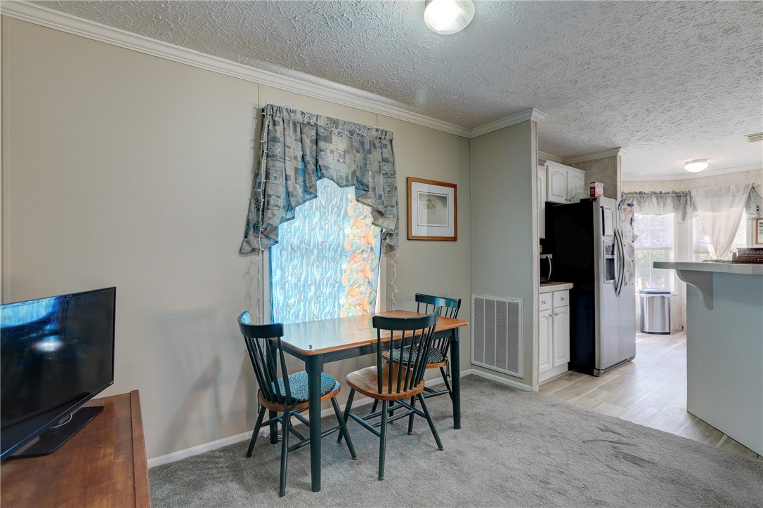 7820 Russell Street Sebastian, FL 32958 - Photo 10 of 36 a view of a dining room with furniture and a kitchen