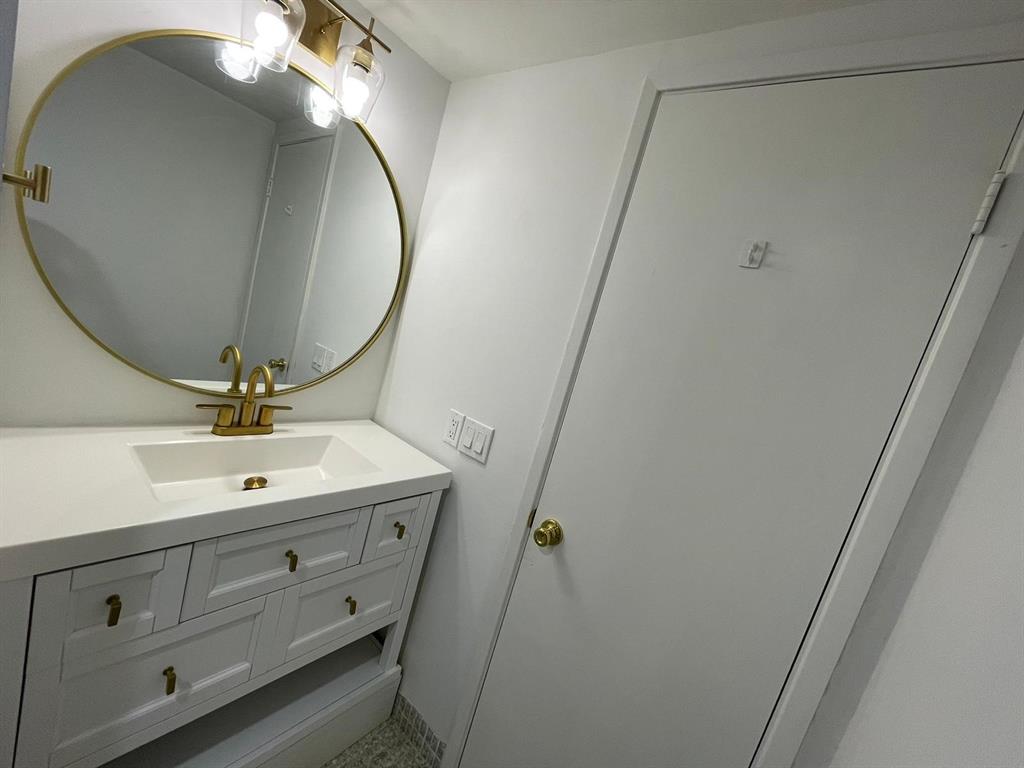 250 Northeast 20th Street, Unit 210 Boca Raton, FL 33431 - Photo 16 of 50 a bathroom with a sink and a mirror