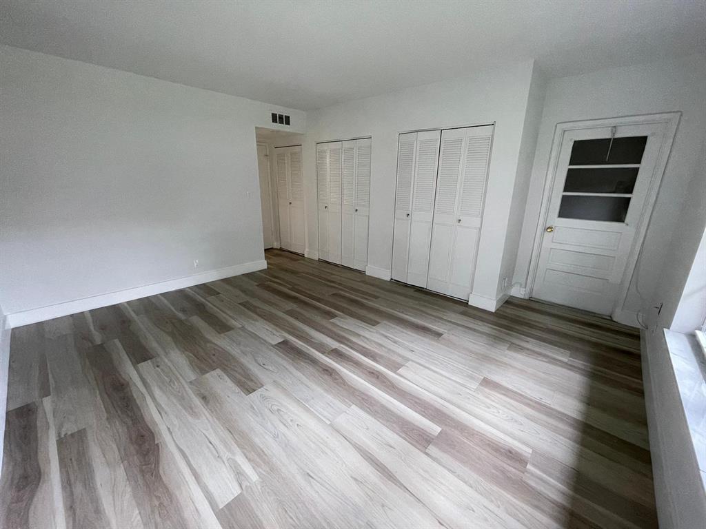 250 Northeast 20th Street, Unit 210 Boca Raton, FL 33431 - Photo 19 of 50 a view of a room with wooden floor
