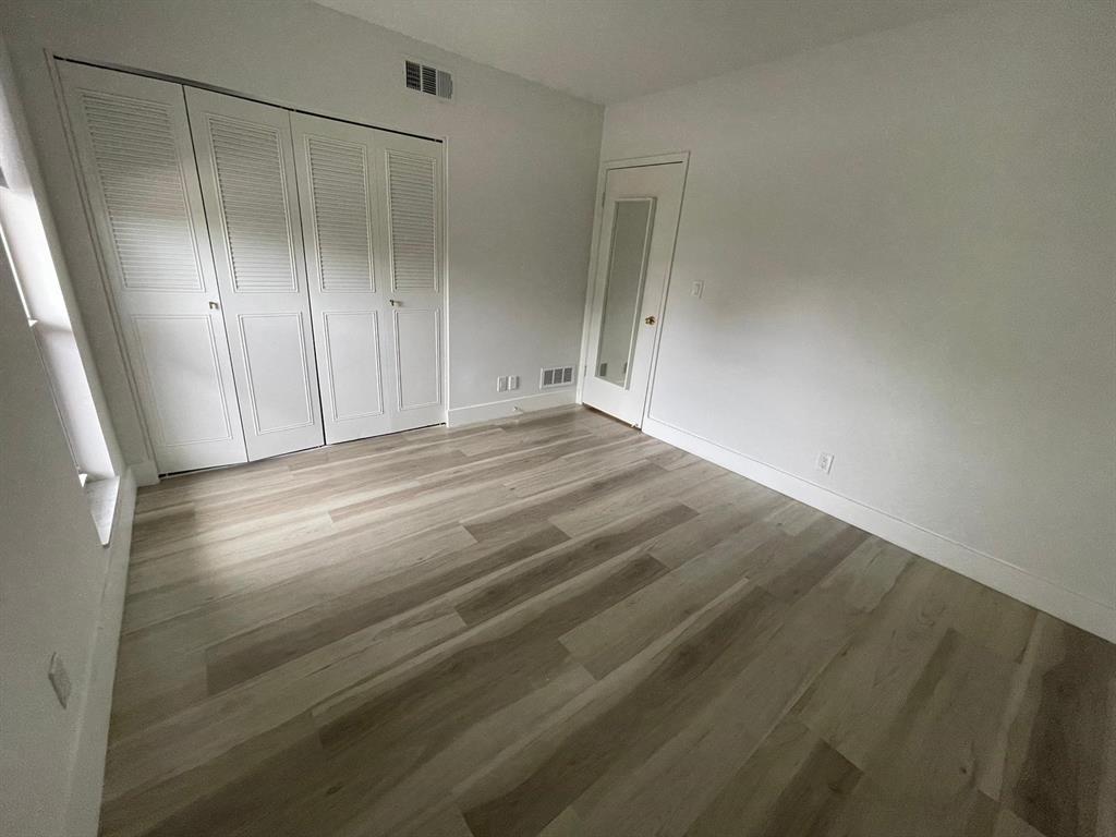 250 Northeast 20th Street, Unit 210 Boca Raton, FL 33431 - Photo 25 of 50 a view of room with wooden floor