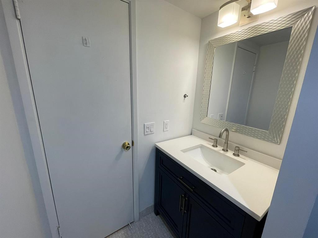 250 Northeast 20th Street, Unit 210 Boca Raton, FL 33431 - Photo 27 of 50 a bathroom with 2 sink and a mirror
