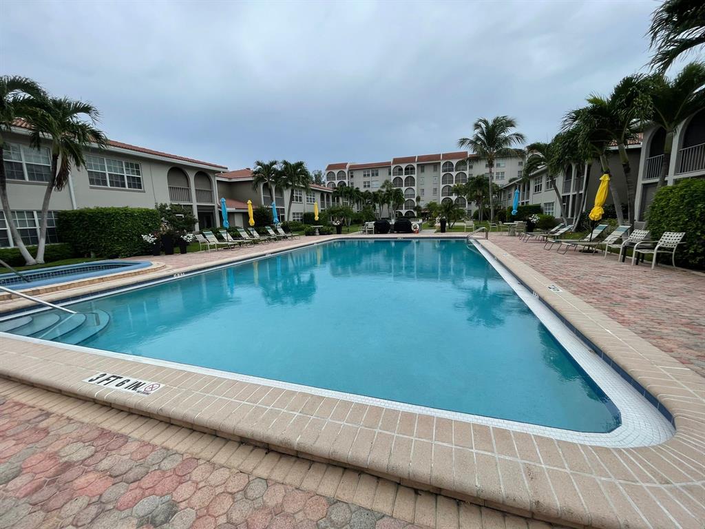 250 Northeast 20th Street, Unit 210 Boca Raton, FL 33431 - Photo 35 of 50 a view of swimming pool from a balcony