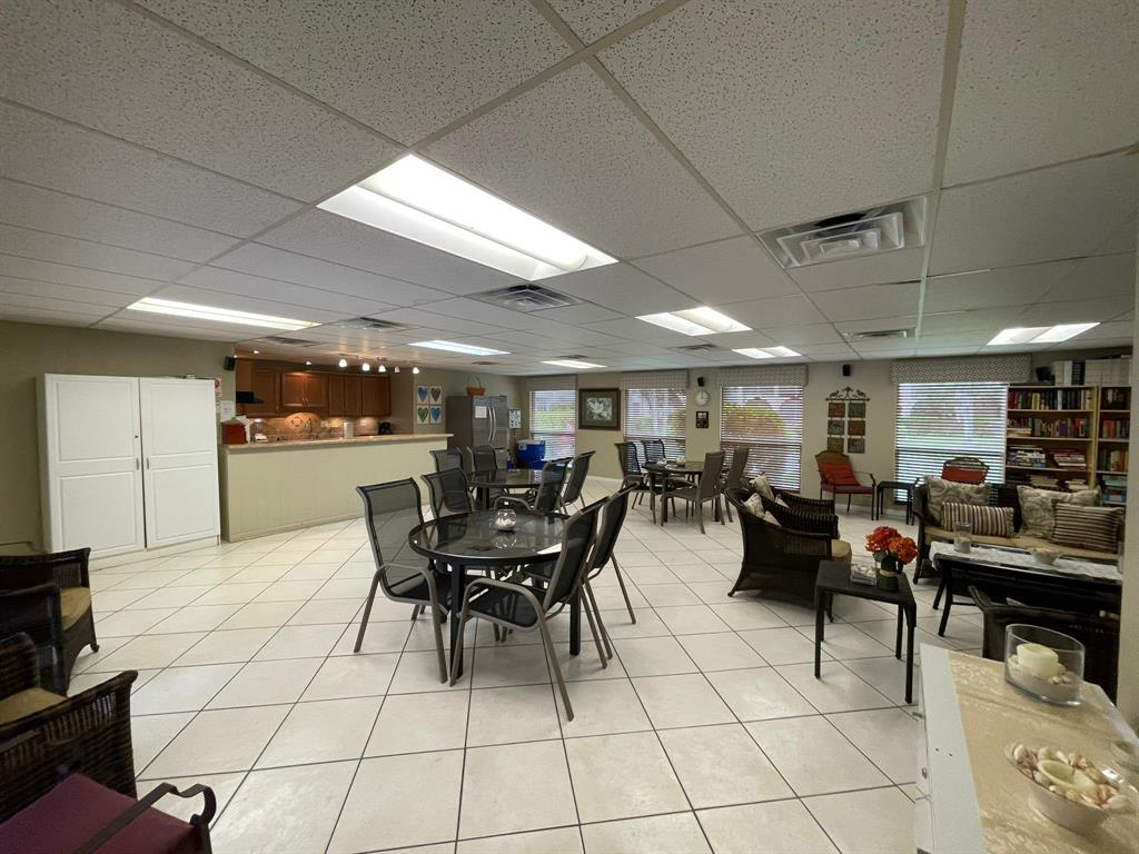 250 Northeast 20th Street, Unit 210 Boca Raton, FL 33431 - Photo 42 of 50 a group of people sitting in a room