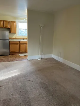 a view of a kitchen with a sink cabinets and a window