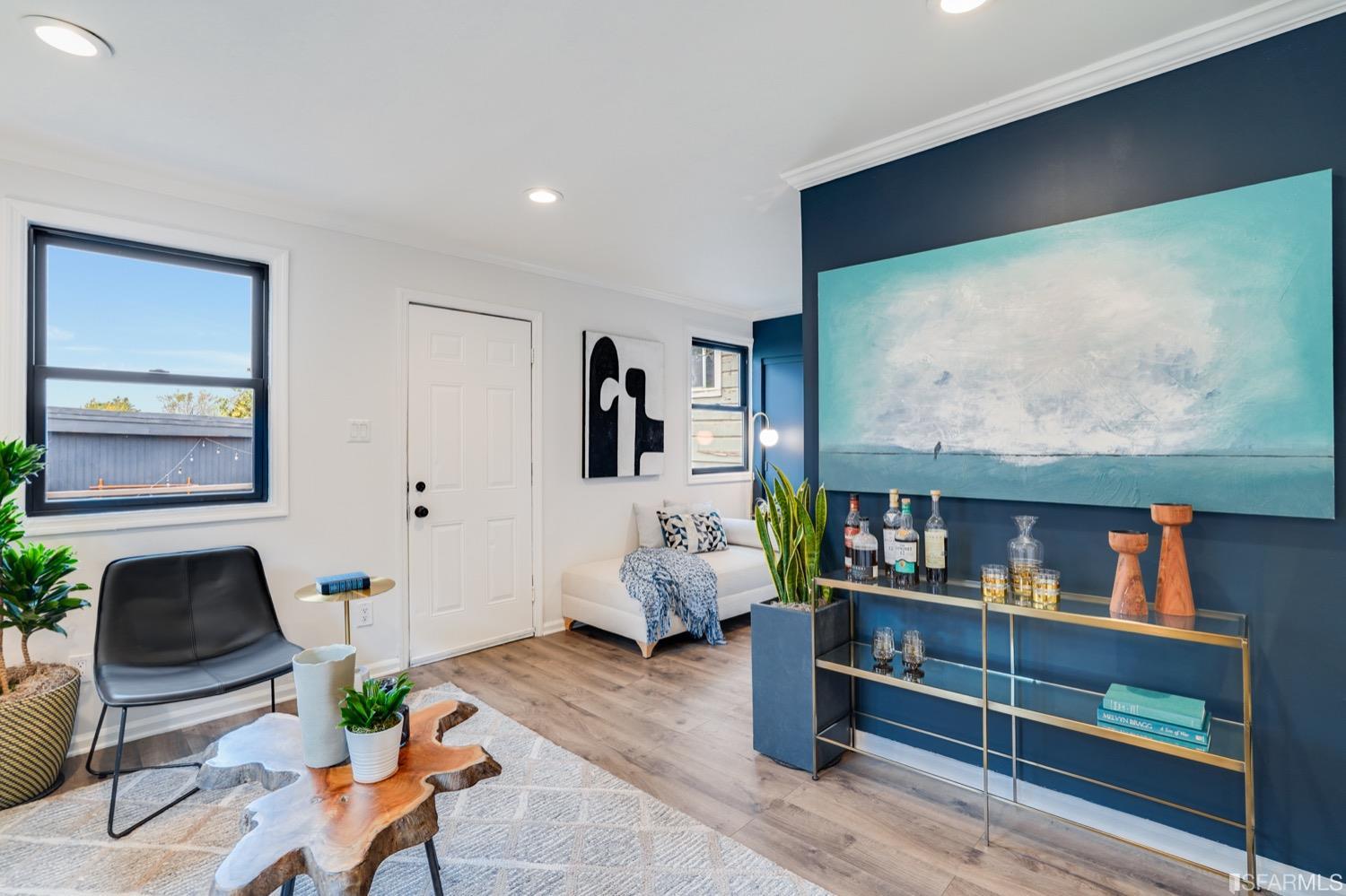 1015 26th Street Oakland, CA 94607 - Photo 1 of 33 a living room with furniture and wooden floor