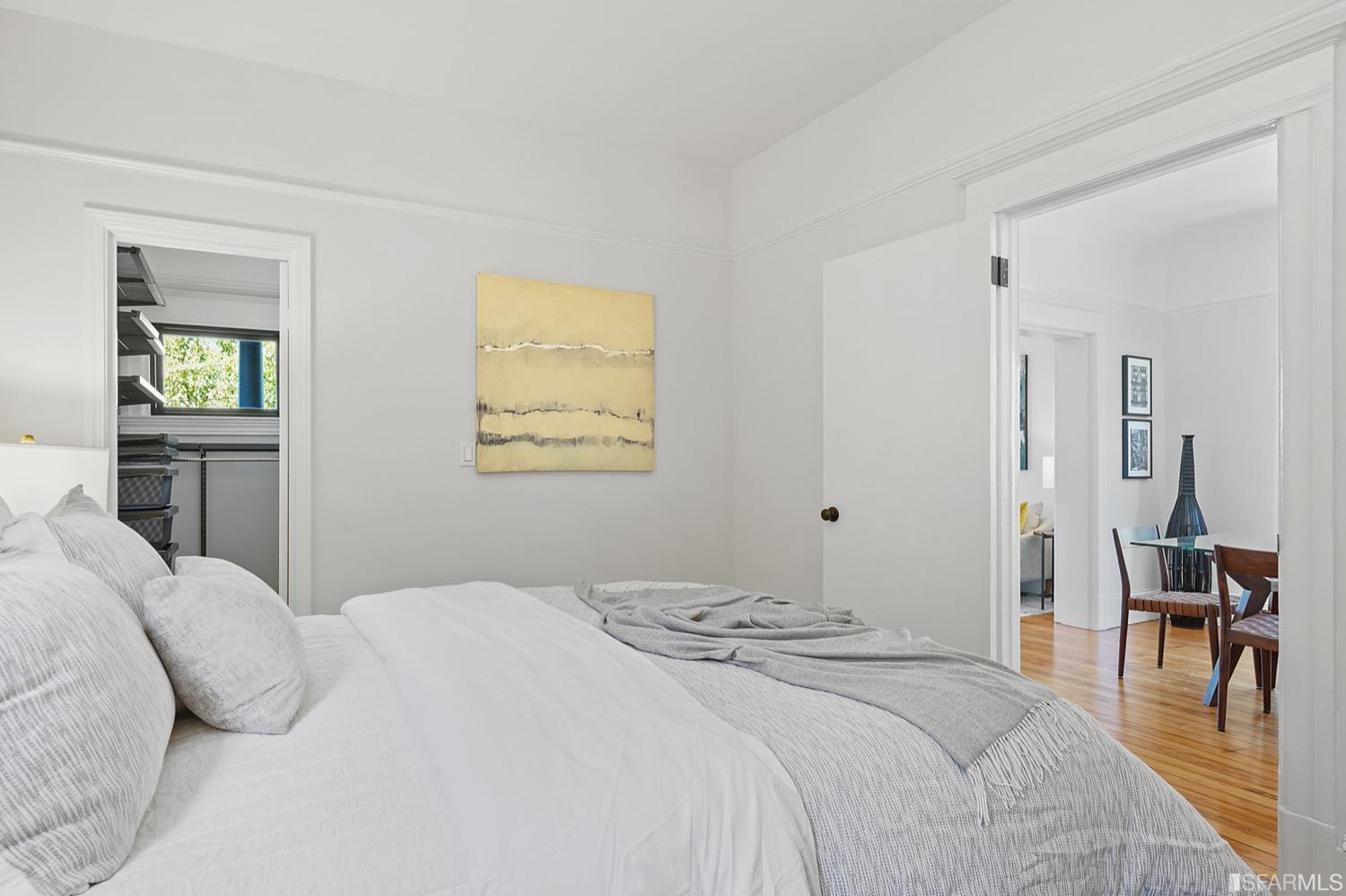 1015 26th Street Oakland, CA 94607 - Photo 15 of 33 a bedroom with a bed and a table