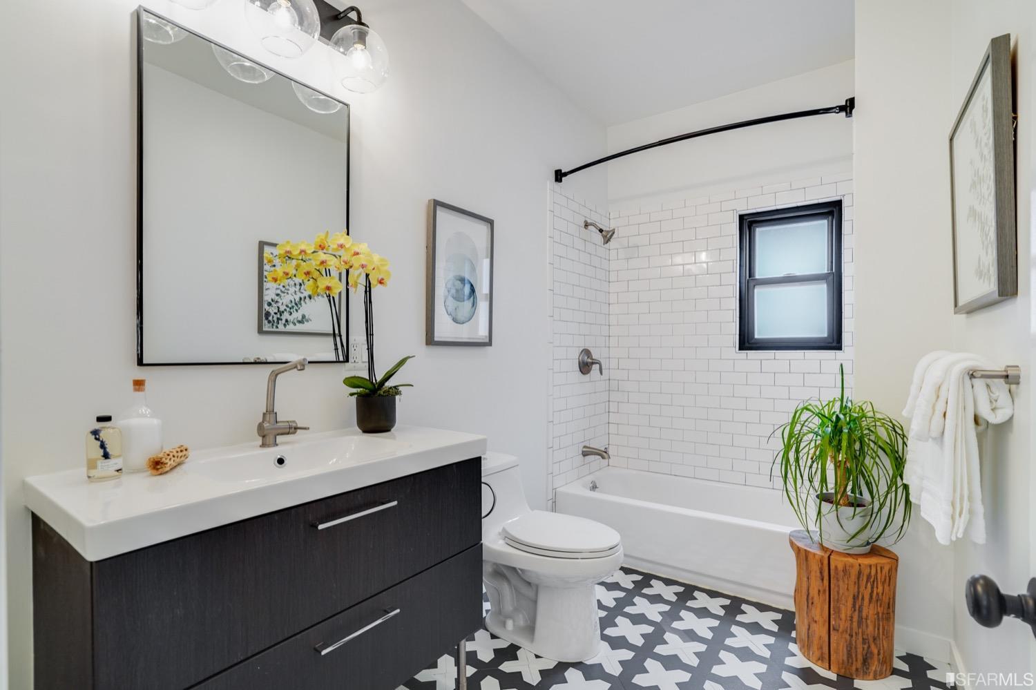 1015 26th Street Oakland, CA 94607 - Photo 18 of 33 a bathroom with a sink toilet and shower