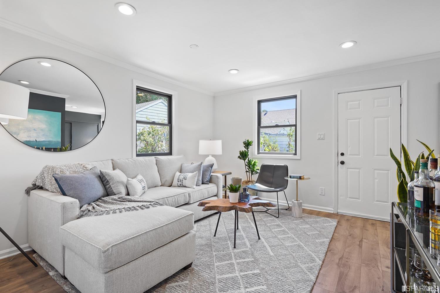 1015 26th Street Oakland, CA 94607 - Photo 19 of 33 a living room with furniture and a wooden floor