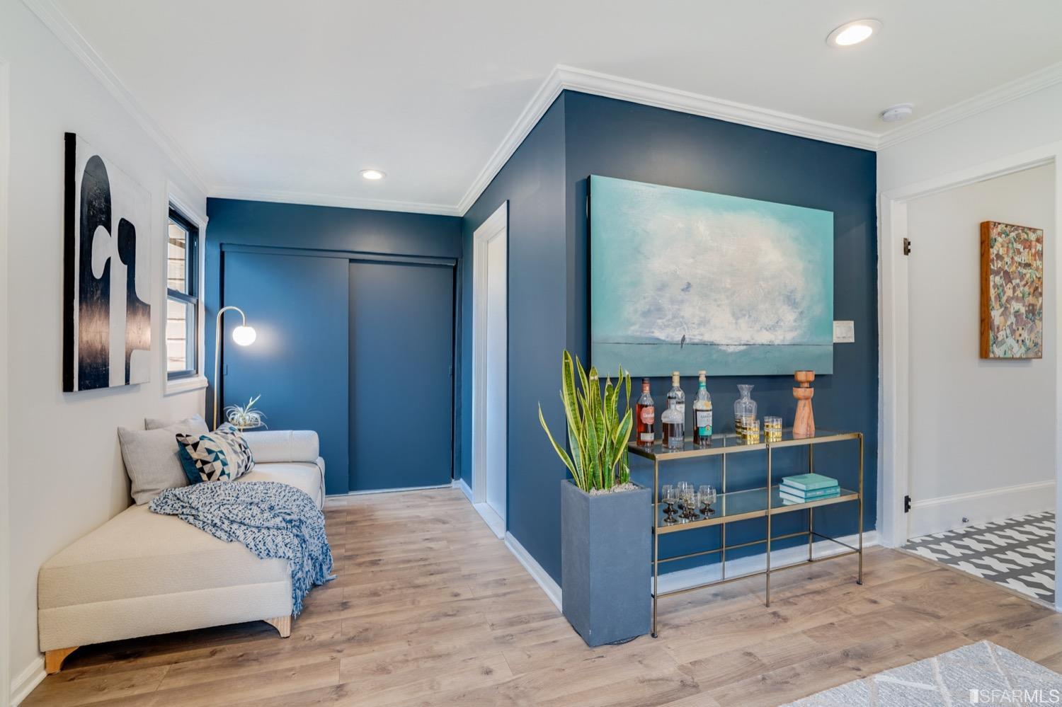 1015 26th Street Oakland, CA 94607 - Photo 20 of 33 a bedroom with furniture and natural light