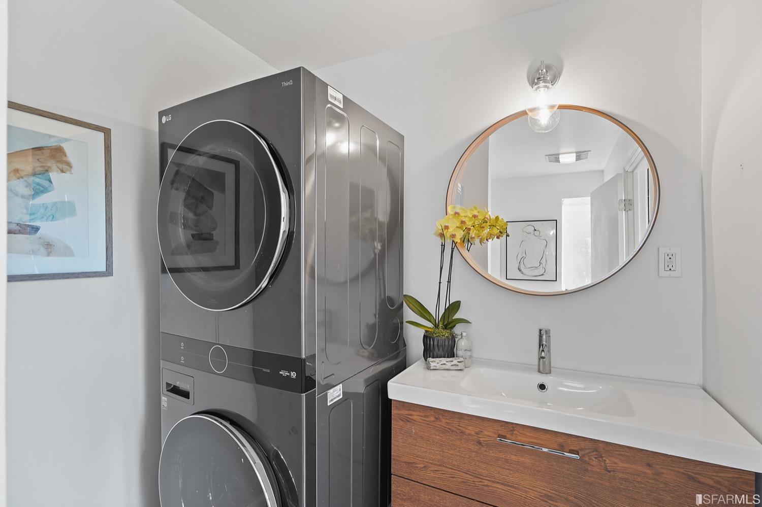 1015 26th Street Oakland, CA 94607 - Photo 22 of 33 a bathroom with a sink and a mirror
