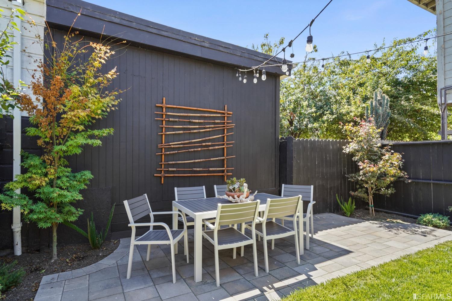 1015 26th Street Oakland, CA 94607 - Photo 26 of 33 a patio with table and chairs and potted plants