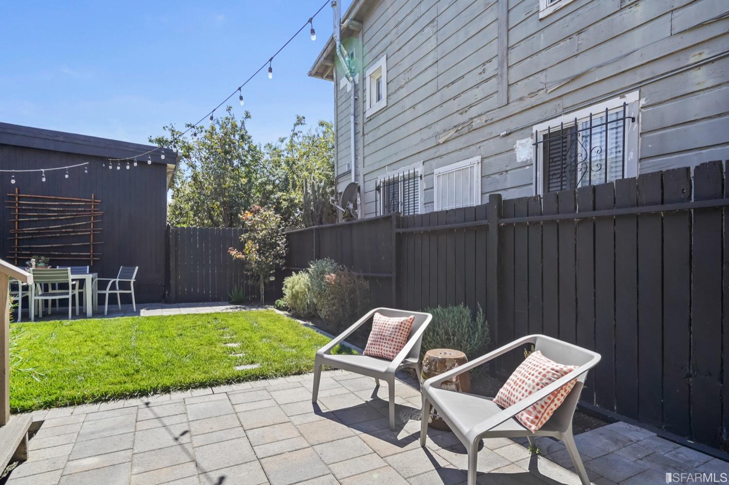 1015 26th Street Oakland, CA 94607 - Photo 31 of 33 a view of a chair and table in backyard of the house
