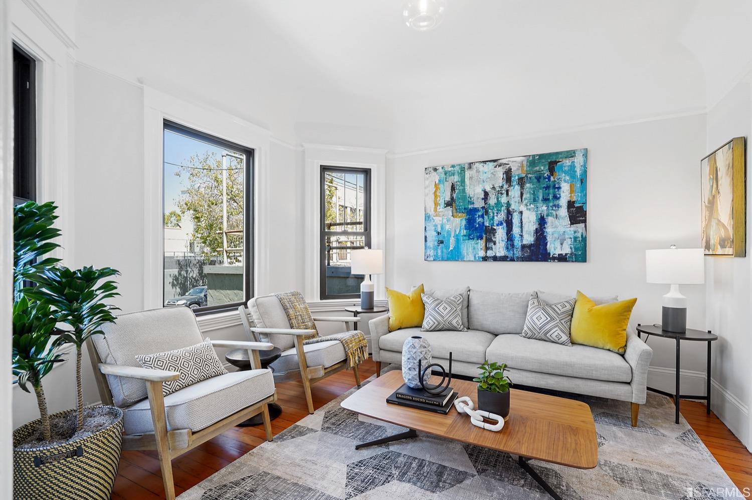 1015 26th Street Oakland, CA 94607 - Photo 5 of 33 a living room with furniture and a large window