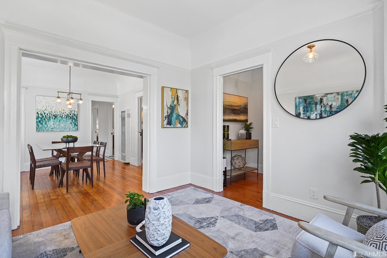 1015 26th Street Oakland, CA 94607 - Photo 7 of 33 a living room with furniture and a wooden floor