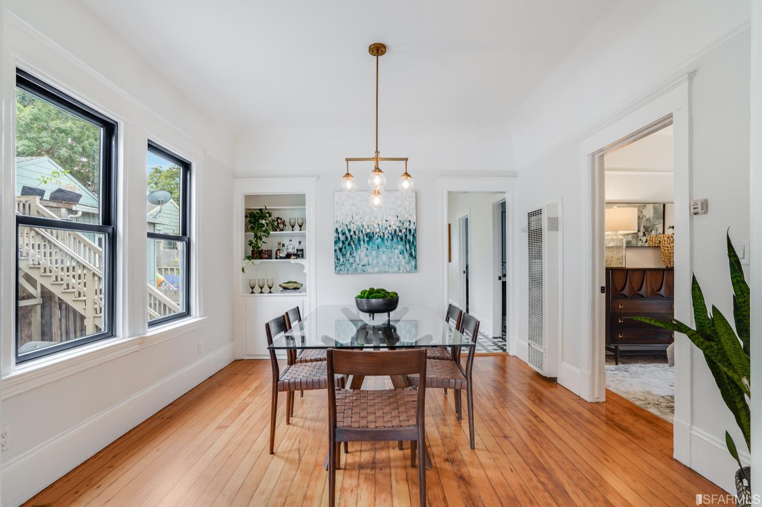 1015 26th Street Oakland, CA 94607 - Photo 8 of 33 a view of a dining room with furniture window and wooden floor