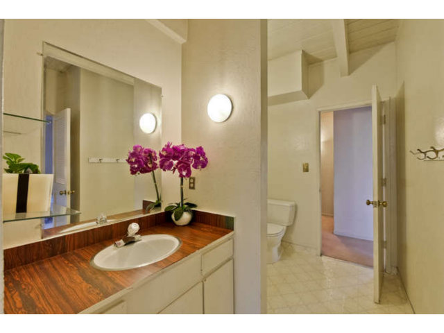 22343 McClellan Road Cupertino, CA 95014 - Photo 12 of 15 a bathroom with a sink and a mirror